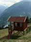 Mobile Preview: Stelzenhaus Hansson XL-A1 Rundstamm Holz Baumhaus Kinderspielhaus auf Stelzen mit Kletterwand und Kinderrutsche