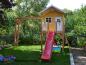 Preview: Stelzenhaus Jonas L-A1 aus Holz Kinderspielhaus Baumhaus mit Schaukel und Rutsche