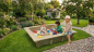 Preview: Kinder spielen im großen Sandkasten SK-1 200x200 cm im Garten