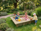 Preview: Kinder spielen im Holz-Sandkasten SK-1 mit Sitzumrandung im Garten