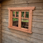 Preview: Eingebautes KASO Sprossen-Fenster FS4 an einer Holzwand eines Kinderspielhauses