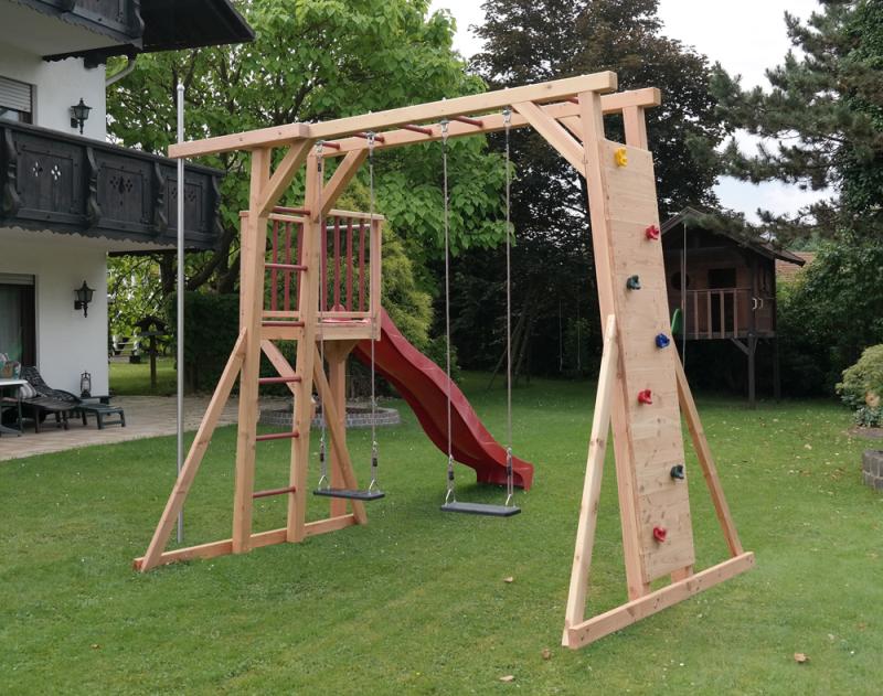 Spielturm Thor-2 aus Holz mit Kletterstange Podest Schaukel und Kletterwand